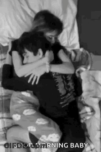 Man And Woman Hugging On Bed GIF