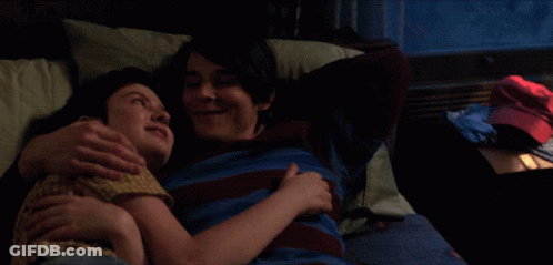 Man And Woman Hugging On Bed GIF