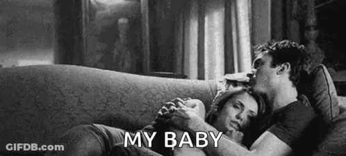 Man And Woman Hugging On Couch GIF