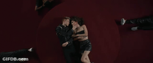 Man And Woman Hugging On Red GIF