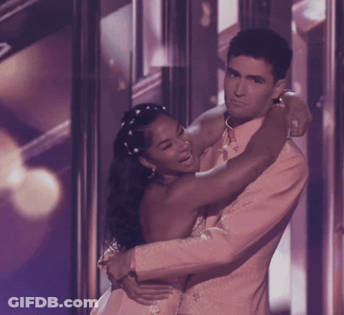 Man And Woman Hugging On Stage GIF
