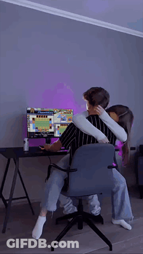 Man And Woman Hugging While Playing Video Game GIF