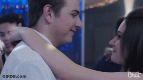 Man And Woman Hugging With Brat GIF
