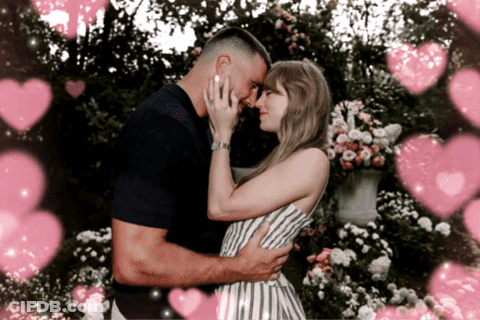 Man And Woman Hugging With Pink Hearts GIF