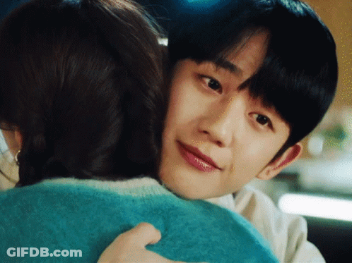 Man And Woman Hugging, Woman In Blue Sweater GIF