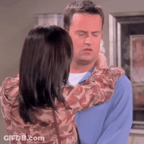 Man And Woman Hugging Woman Touching Man's Neck GIF