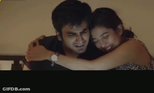 Man And Woman Hugging Woman Wearing Watch GIF