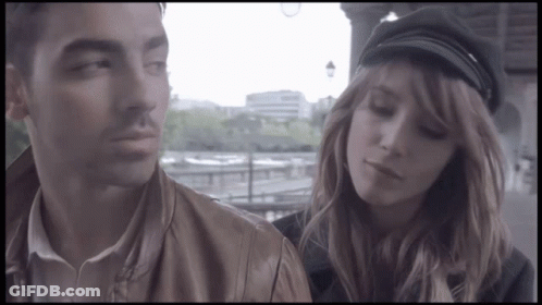 Man And Woman In Black Hat GIF