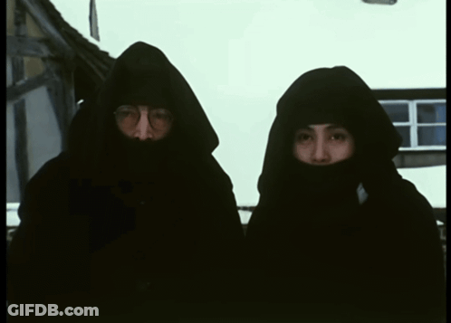 Man And Woman In Black Hooded Sweatshirts GIF