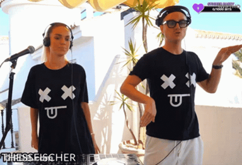 Man And Woman In Black Shirts With X And U GIF