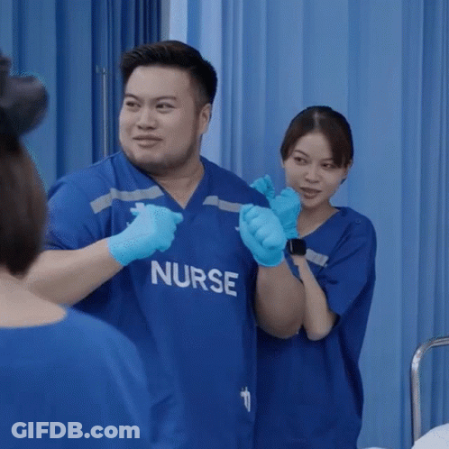 Man And Woman In Blue Nurse Scrubs GIF