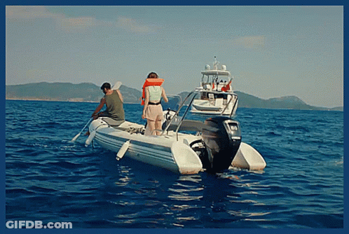 Man And Woman In Boat On Ocean GIF
