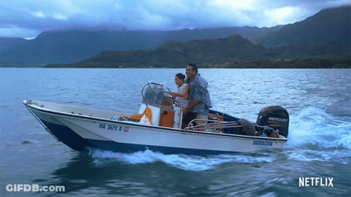 Man And Woman In Boat With Mercury Motor GIF