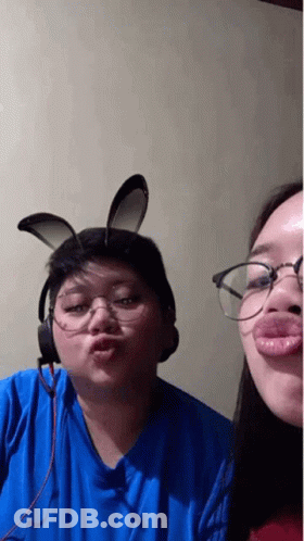 Man And Woman In Bunny Ears And Glasses Making A Face GIF