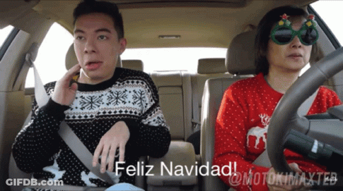 Man And Woman In Car Feliz Navidad GIF