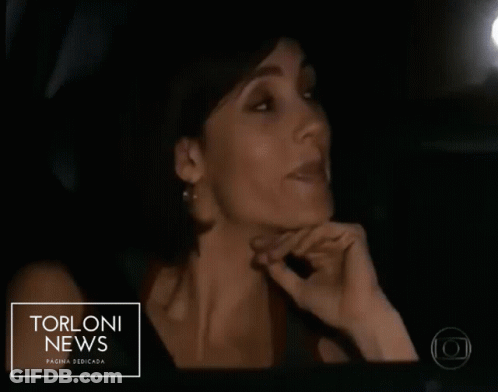 Man And Woman In Car With Torloni News GIF