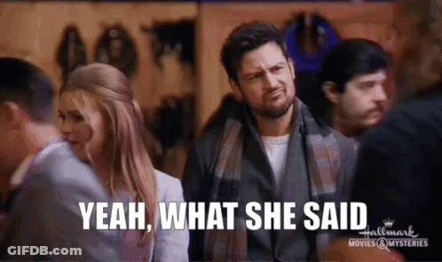 Man And Woman In Crowd Saying Yeah What She Said GIF