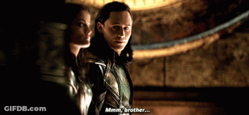 Man And Woman In Dark Room Saying Hmm Brother GIF