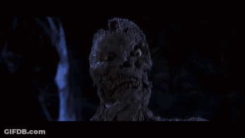 Man And Woman In Dark Room With Mummy GIF