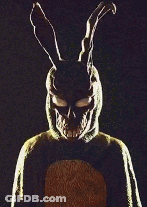 Man And Woman In Dark Room With Rabbit Mask GIF