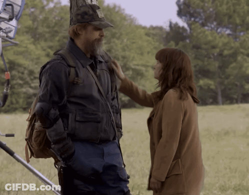 Man And Woman In Field Woman Touching Shoulder GIF