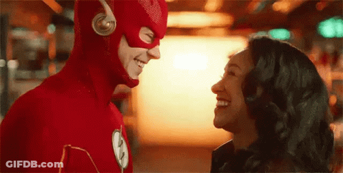 Man And Woman In Flash Costumes GIF