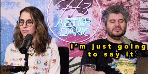 Man And Woman In Front Of After Dark Neon Sign GIF