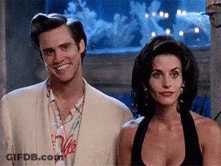 Man And Woman In Front Of Aquarium GIF