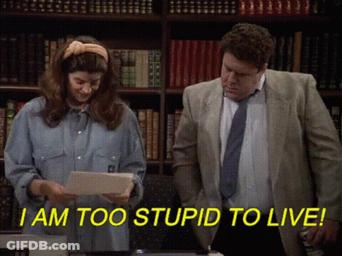 Man And Woman In Front Of Bookshelf GIF