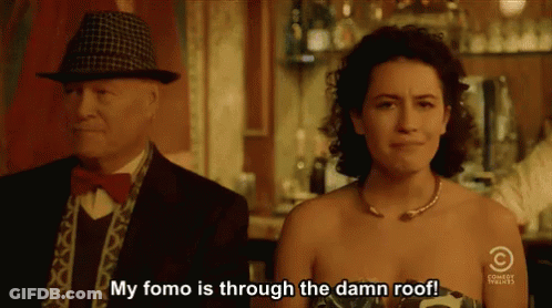 Man And Woman In Front Of Comedy Central Sign GIF