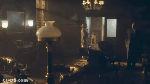 Man And Woman In Front Of Door Saying Holly GIF