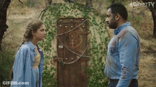 Man And Woman In Front Of Door With Female Symbol GIF