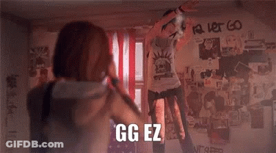 Man And Woman In Front Of Graffiti Wall Saying GG EZ GIF