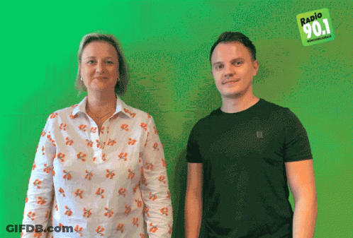 Man And Woman In Front Of Green Background Saying Radio 90.1 GIF