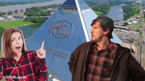 Man And Woman In Front Of Pyramid Of The States GIF