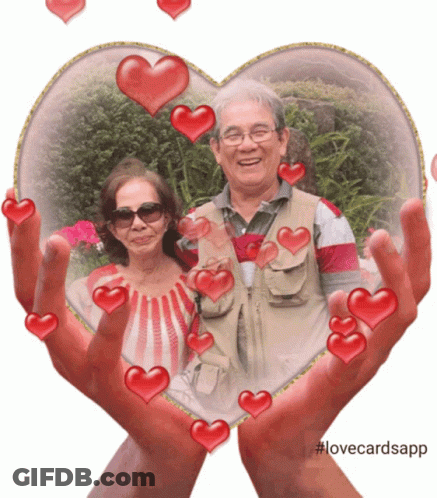 Man And Woman In Heart Frame With Hearts GIF