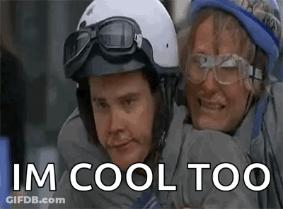 Man And Woman In Helmets And Goggles Hugging GIF