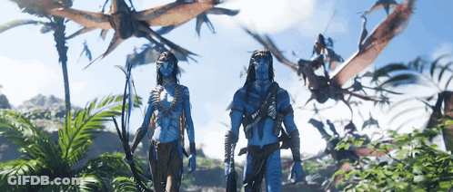 Man And Woman In Jungle With Flying Animals GIF
