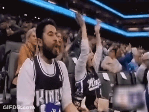 Man And Woman In Kings Jerseys Sitting In Crowd GIF