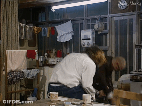 Man And Woman In Kitchen Saying Quicky Merky GIF