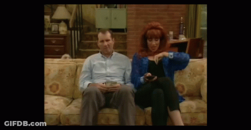 Man And Woman In Living Room With Couch GIF