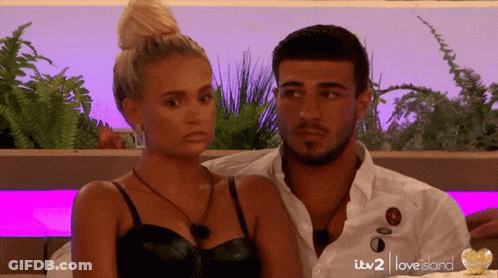 Man And Woman In Love Island Scene GIF