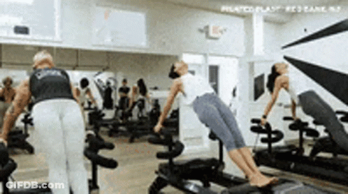 Man And Woman In Pilates Blast Gym GIF