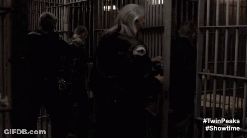 Man And Woman In Prison Cell GIF