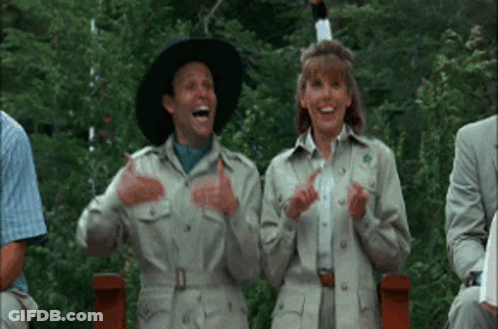 Man And Woman In Safari Outfits Clapping And Laughing GIF