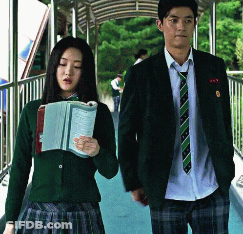 Man And Woman In School Uniforms Walking Down Bridge GIF