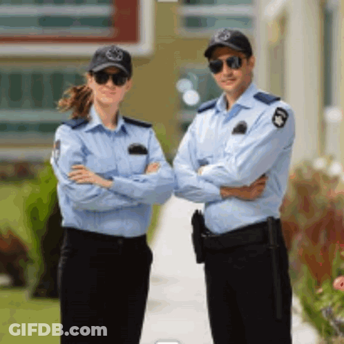 Man And Woman In Security Uniforms Standing Together GIF