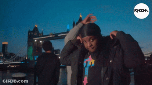 Man And Woman In Sunglasses And Hoodies Posing GIF