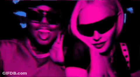 Man And Woman In Sunglasses In Pink Light GIF