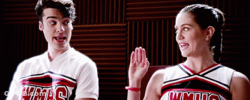 Man And Woman In WMHS Cheerleading Uniforms GIF
